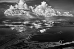 09-4-4533The Anavilhanas, the name given to around 350 forested islands in Brazil???s Rio Negro, form the world???s largest inland archipelago. Covering 1,000 square kilometers of Amazonia, they start 80 kilometers north-west of Manaus and stretch some 400 kilometers up the Rio Negro as far as Barcelos.  Their formation dates back to the last Ice Age when changes in the flows of rivers entering the Rio Negro produced accumulations of sediment which, over time, resulted in sandbars and islands. Since water levels change with the seasons by as much as 20 meters, the Anavilhanas are themselves ever-changing, with channels, sandbars and lagoons appearing during the dry season and some small islands vanishing when waters rise. Many of the larger islands, though, are self-contained parcels of rain forest.Brazil. May 2009.